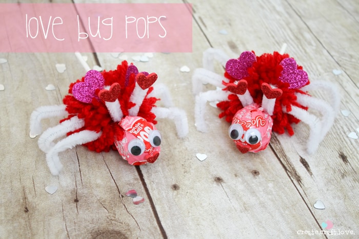 Using Valentine Tootsie Pops, I created these Love Bug Pops for the kiddo to pass out to his classmates! via createcraftlove.com #valentinesday #pompom #valentineideas #kidsproject