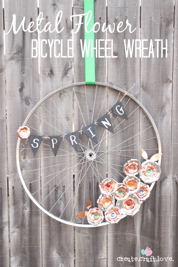 Create this Metal Flower Bicycle Wheel Wreath with a little help from the Cricut Explore!  #explorecricut #wreath #spring #decor