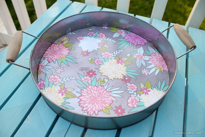 All you need is a little scrapbook paper and mod podge to create this Upcycled Beverage Tray via createcraftlove.com #upcycle #summer #modpodge