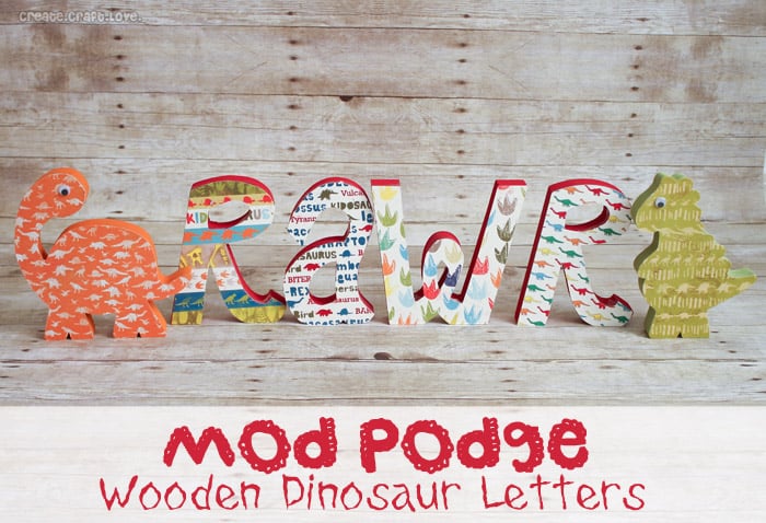 Mod Podge Wooden Dinosaur Letters via createcraftlove.com #modpodge #woodenletters #artsychaos #dinosaurs