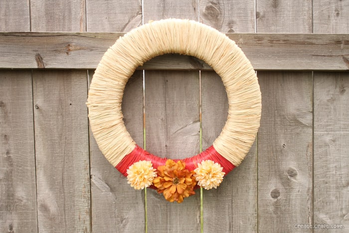 Raffia Wrapped Fall Wreath via createcraftlove.com #fall #wreath