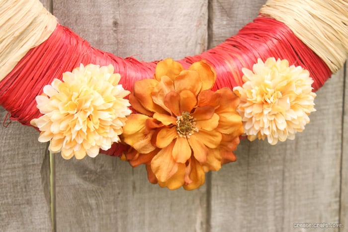 Raffia Wrapped Fall Wreath via createcraftlove.com #fall #wreath
