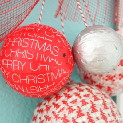 You can whip this Styrofoam Washi Tape Ornament Wreath in less than 10 minutes!! Check out the tutorial at createcraftlove.com! #christmas #washitape #25daysofchristmas #styrofoam #wreath