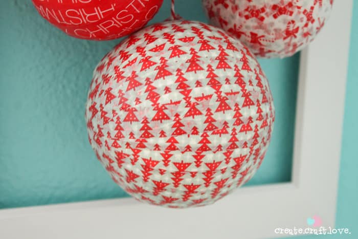 You can whip this Styrofoam Washi Tape Ornament Wreath in less than 10 minutes!! Check out the tutorial at createcraftlove.com! #christmas #washitape #25daysofchristmas #styrofoam #wreath