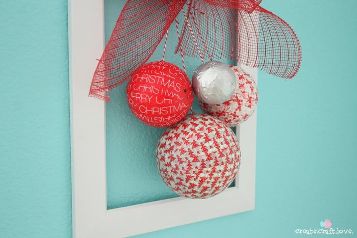You can whip this Styrofoam Washi Tape Ornament Wreath in less than 10 minutes!! Check out the tutorial at createcraftlove.com! #christmas #washitape #25daysofchristmas #styrofoam #wreath