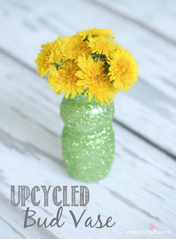 Upcycle an old yogurt cup to create these upcycled Bud Vases! via createcraftlove.com 