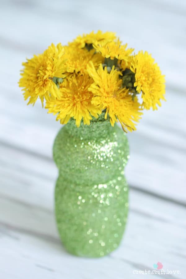 Upcycle an old yogurt cup to create these upcycled Bud Vases! via createcraftlove.com
