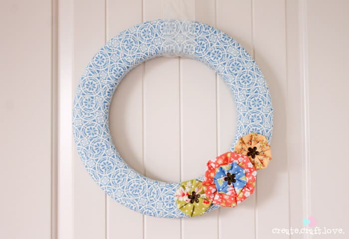 Vintage Scrap Wreath made from left over scrap fabric! via createcraftlove.com #wreath #fabric #summer