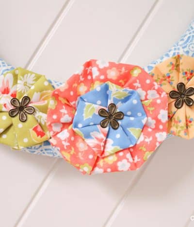 Vintage Scrap Wreath made from left over scrap fabric! via createcraftlove.com #wreath #fabric #summer