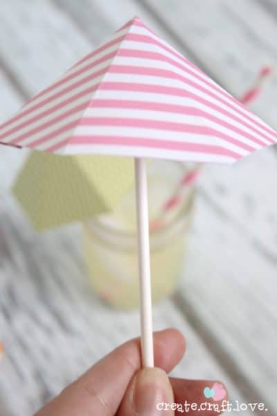 Create your own DIY Drink Umbrellas with some cardstock and lollipop sticks! via createcraftlove.com for The 36th Avenue
