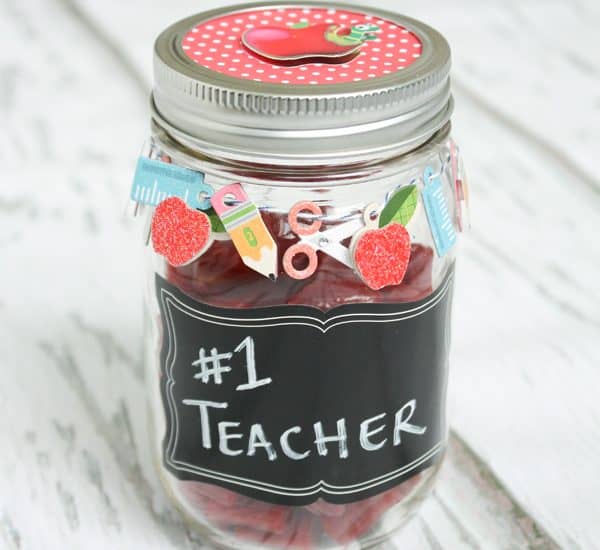 Grab some scrapbook embellishments, a mason jar and some candy to create this Mason Jar Gift for Teacher's Appreciation Week! www.createcraftlove.com