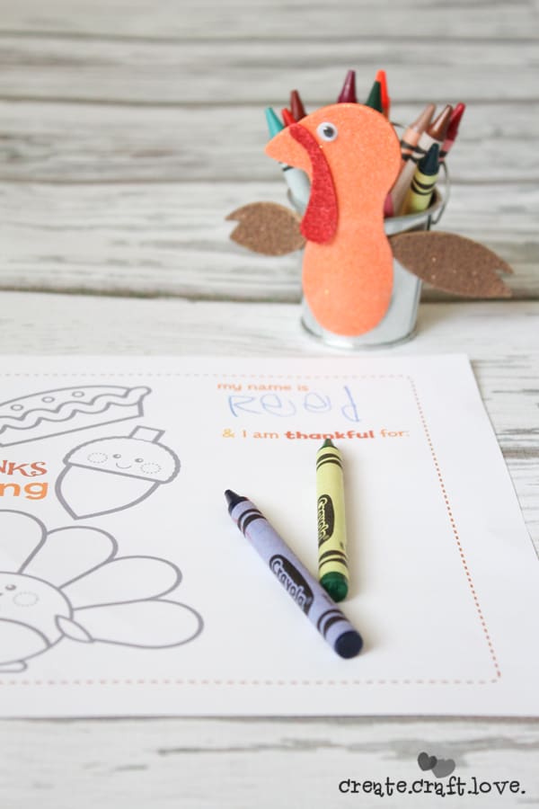 This Turkey Crayon Caddy makes an adorable centerpiece at the kid's table and costs less than $3 to make! via createcraftlove.com #fallharvestideas