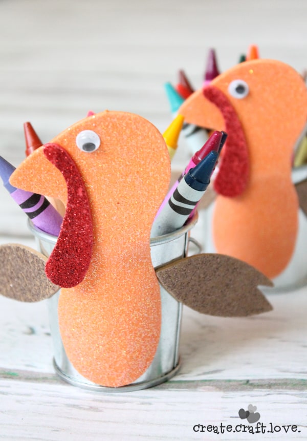 This Turkey Crayon Caddy makes an adorable centerpiece at the kid's table and costs less than $3 to make! via createcraftlove.com #fallharvestideas