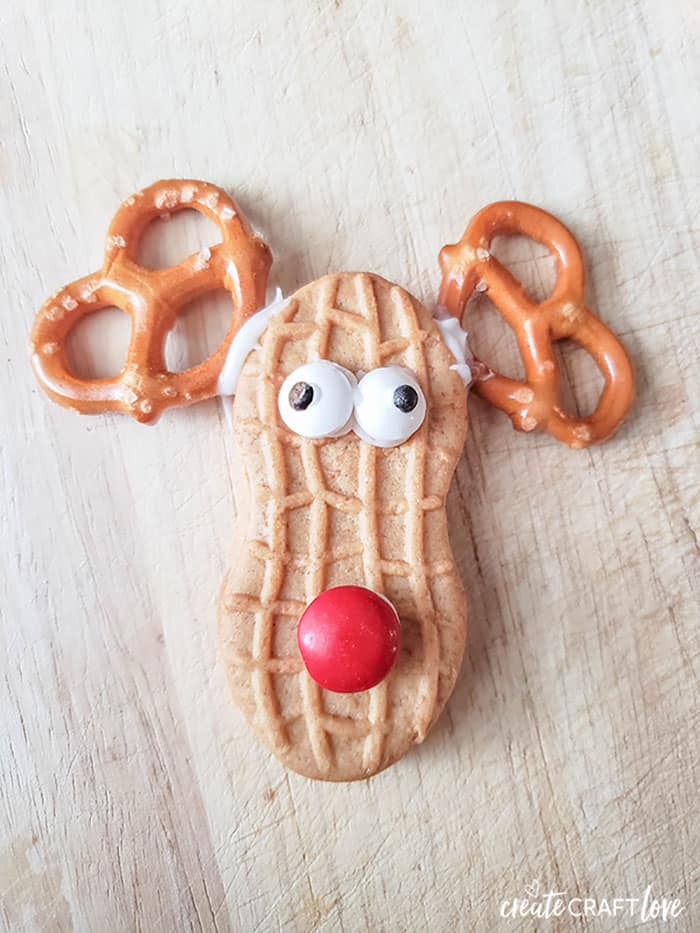 Add candy eyeballs and red M&M to finish the Easy Reindeer Cookies!