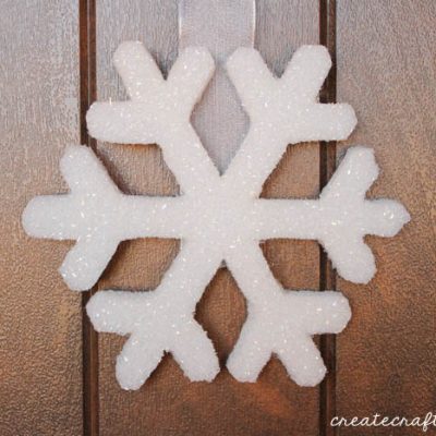 This Snowflake Door Hanging can remain up all winter long! via createcraftlove.com