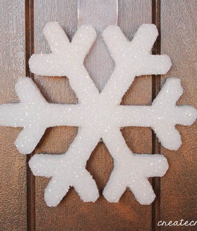This Snowflake Door Hanging can remain up all winter long! via createcraftlove.com
