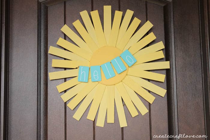 This Hello Sunshine Spring Wreath is the perfect door decoration to greet your guests! via createcraftlove.com