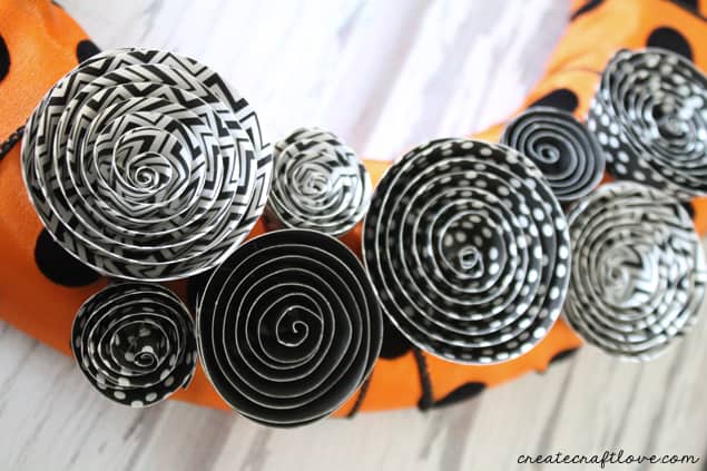 This Halloween Mini Wreath sports the traditional orange and black with but stays trendy with polkadots and stripes!