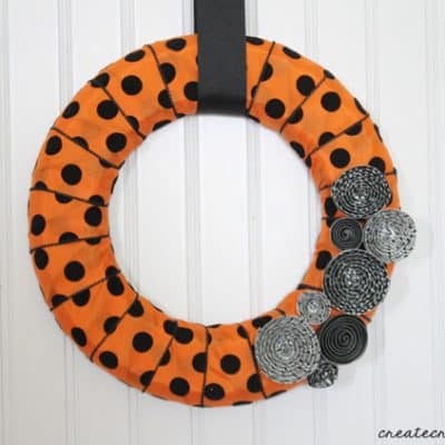 This Halloween Mini Wreath sports the traditional orange and black with but stays trendy with polkadots and stripes!