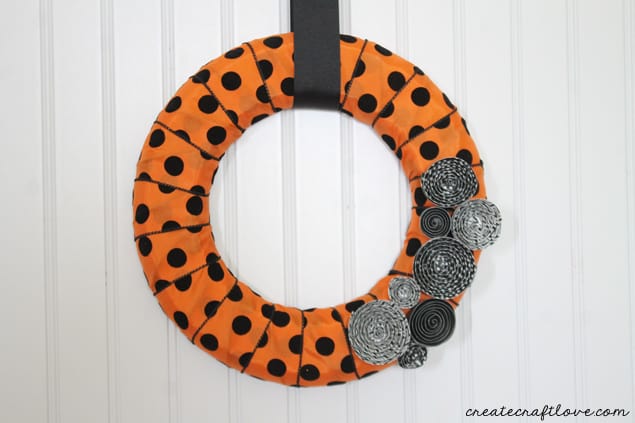 This Halloween Mini Wreath sports the traditional orange and black with but stays trendy with polkadots and stripes!