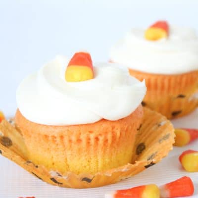 You don't have to be a fan of candy corn to love these vanilla Candy Corn Cupcakes! via createcraftlove.com