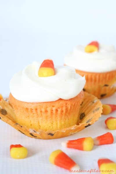 You don't have to be a fan of candy corn to love these vanilla Candy Corn Cupcakes! via createcraftlove.com