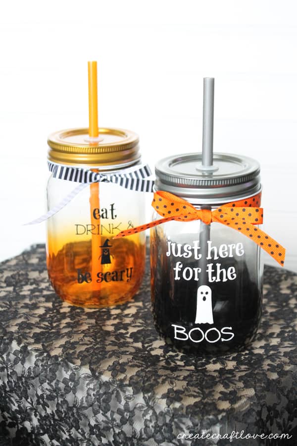 Whether you partake in an alcoholic beverage or not, these are the cutest Halloween Mason Jar Drink Glasses! via createcraftlove.com