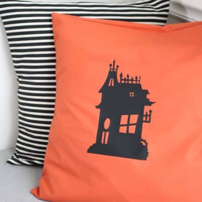 I whipped up this Haunted House Pillow with a little iron on vinyl! via createcraftlove.com