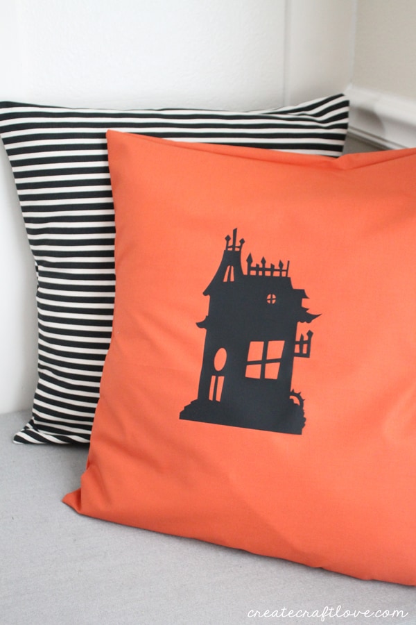 I whipped up this Haunted House Pillow with a little iron on vinyl! via createcraftlove.com