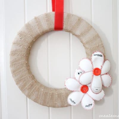 This Baseball Wreath complete with baseball flowers is the best way to welcome spring (training)! via createcraftlove.com