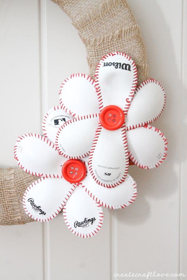 This Baseball Wreath complete with baseball flowers is the best way to welcome spring (training)! via createcraftlove.com