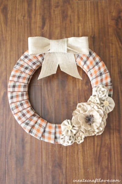This Burlap and Plaid Fall Wreath is the perfect way to greet guests this autumn!