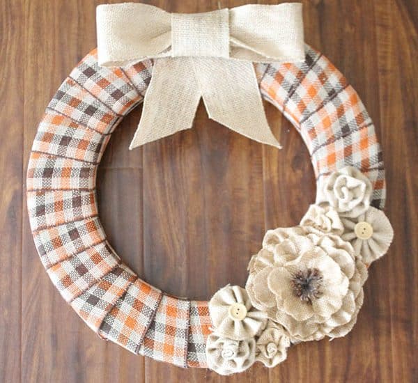 This Burlap and Plaid Fall Wreath is the perfect way to greet guests this autumn!