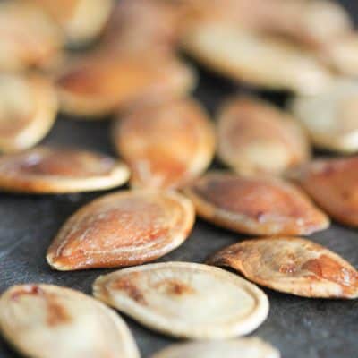 Roasted Pumpkin Seeds are the happy leftovers after a full day of pumpkin everything! via createcraftlove.com