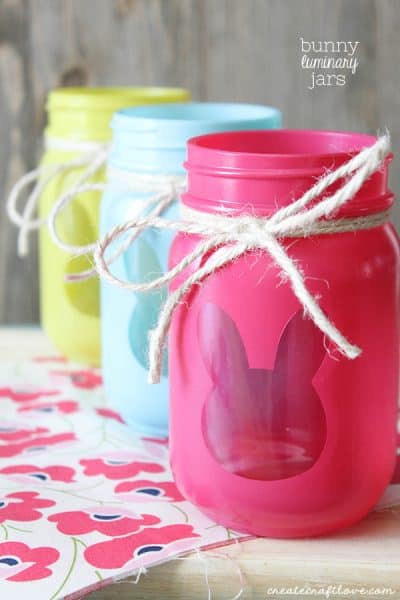 These Bunny Luminary Jars boast bright spring colors with a surprise on the back! via createcraftlove.com