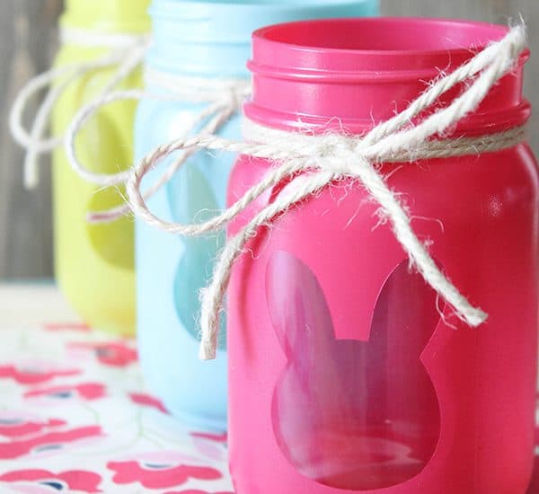 These Bunny Luminary Jars boast bright spring colors with a surprise on the back! via createcraftlove.com