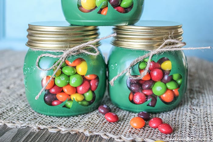 These Shamrock Gift Jars are a sweet treat with a hint of the rainbow! via createcraftlove.com