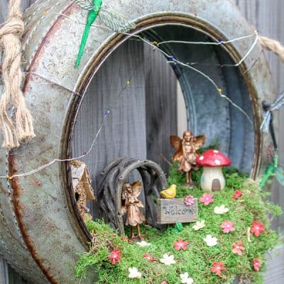 Create a whimsical fairy habitat to welcome spring!  This Fairy Garden Wreath will impress any guest! #ad #hobbylobbystyle #hobbylobbymade