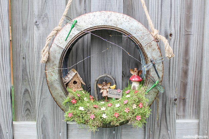 Create a whimsical fairy habitat to welcome spring! This Fairy Garden Wreath will impress any guest! #ad #hobbylobbystyle #hobbylobbymade