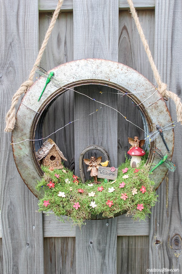 Create a whimsical fairy habitat to welcome spring! This Fairy Garden Wreath will impress any guest! #ad #hobbylobbystyle #hobbylobbymade