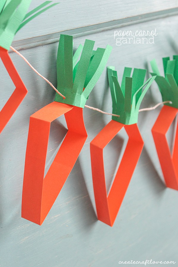 This Paper Carrot Garland is a great kids craft and can be done without a cutting machine! via createcraftlove.com