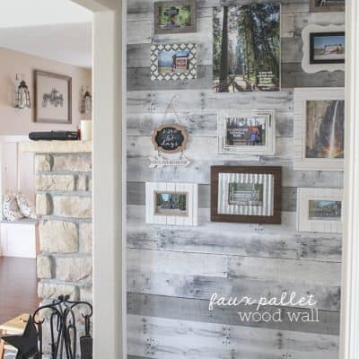 Use adhesive wall paper to create a statement Faux Pallet Wood Wall!