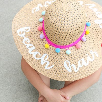 Protect your face from the sun's harmful rays with our trendy DIY Beach Hat with Iron On Vinyl!
