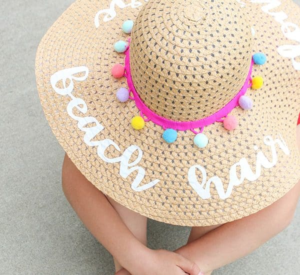 Protect your face from the sun's harmful rays with our trendy DIY Beach Hat with Iron On Vinyl!