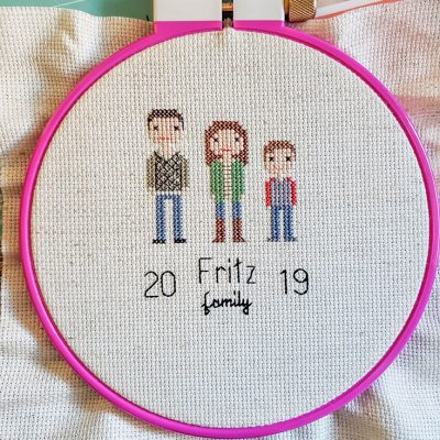 family cross stitching with stitch people