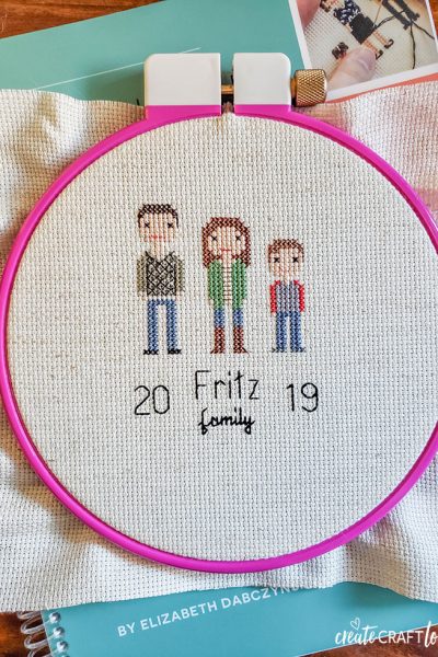 family cross stitching with stitch people