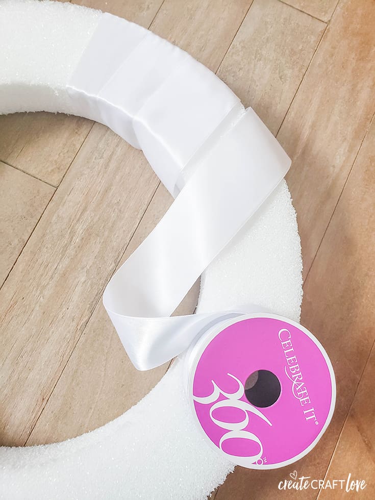 Wrap your Rainbow Ribbon Wreath in white before adding the color